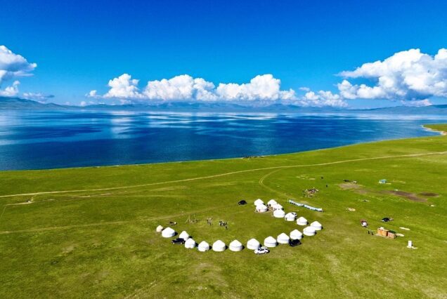 Song-Kol Lake surrounded by snow-capped mountains.