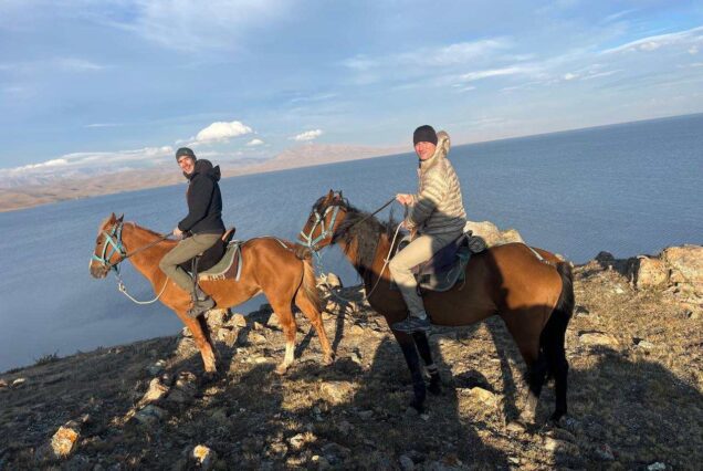 Tourists horseback riding around Song-Kol Lake Kyrgyz Wonders Kyrgyzstan