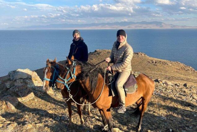 Tourists horseback riding around Song-Kol Lake Kyrgyz Wonders Kyrgyzstan