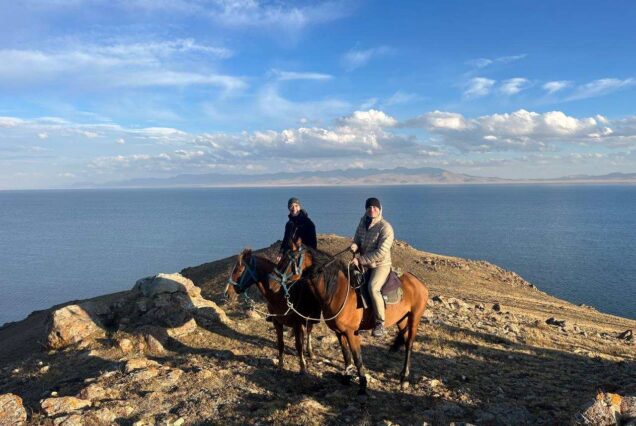 Tourists horseback riding around Song-Kol Lake Kyrgyz Wonders Kyrgyzstan