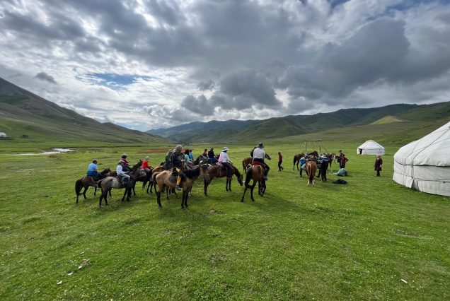 Tourists horseback riding around Song-Kol Lake Kyrgyz Wonders Kyrgyzstan