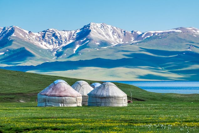 Nomadic yurt camp at Song-Kol Lake during sunset.