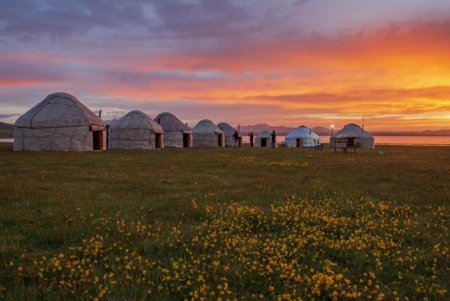 Nomadic yurt camp at Song-Kol Lake during sunset.